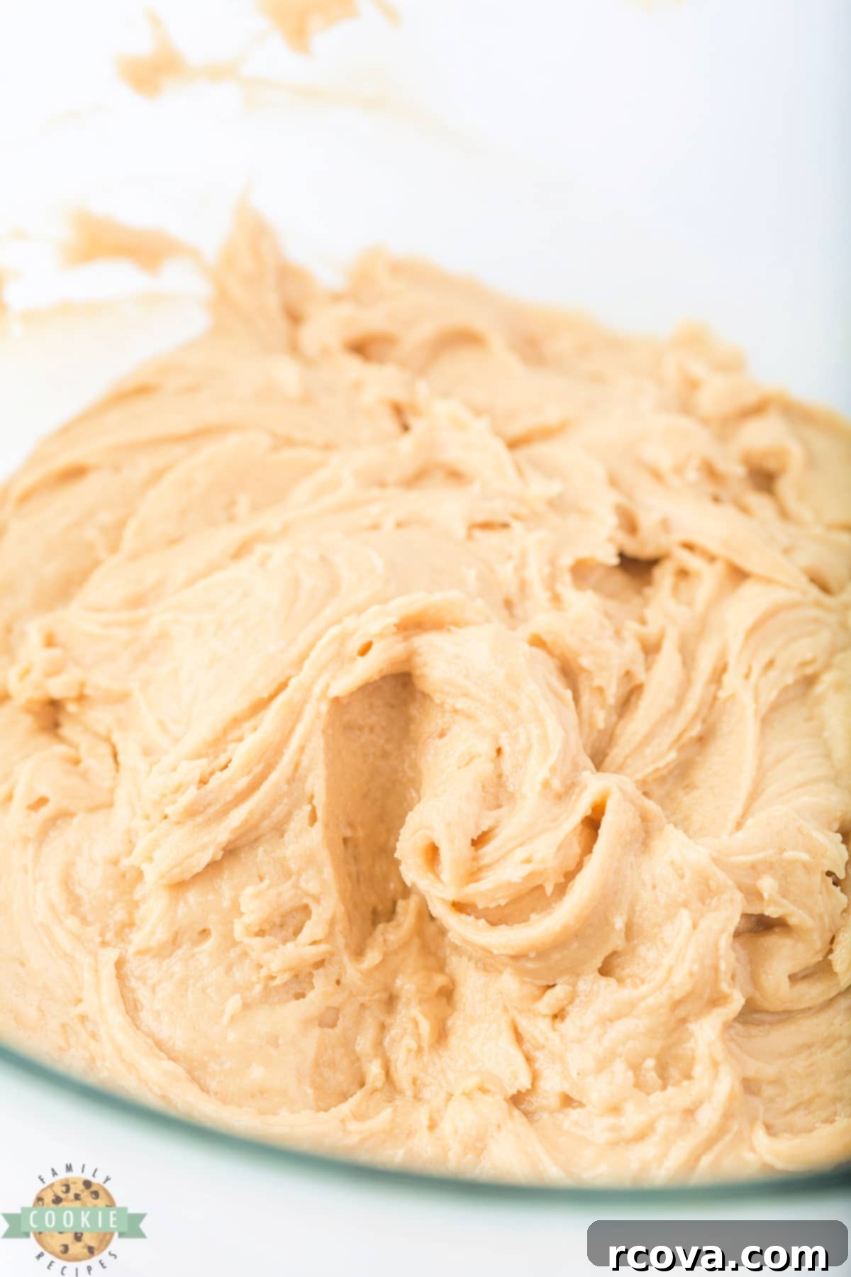 Sweet & Savory Maple Bacon Cookies 6 Raw maple bacon cookie dough in a mixing bowl, showcasing its rich brown color and smooth consistency before chilling.