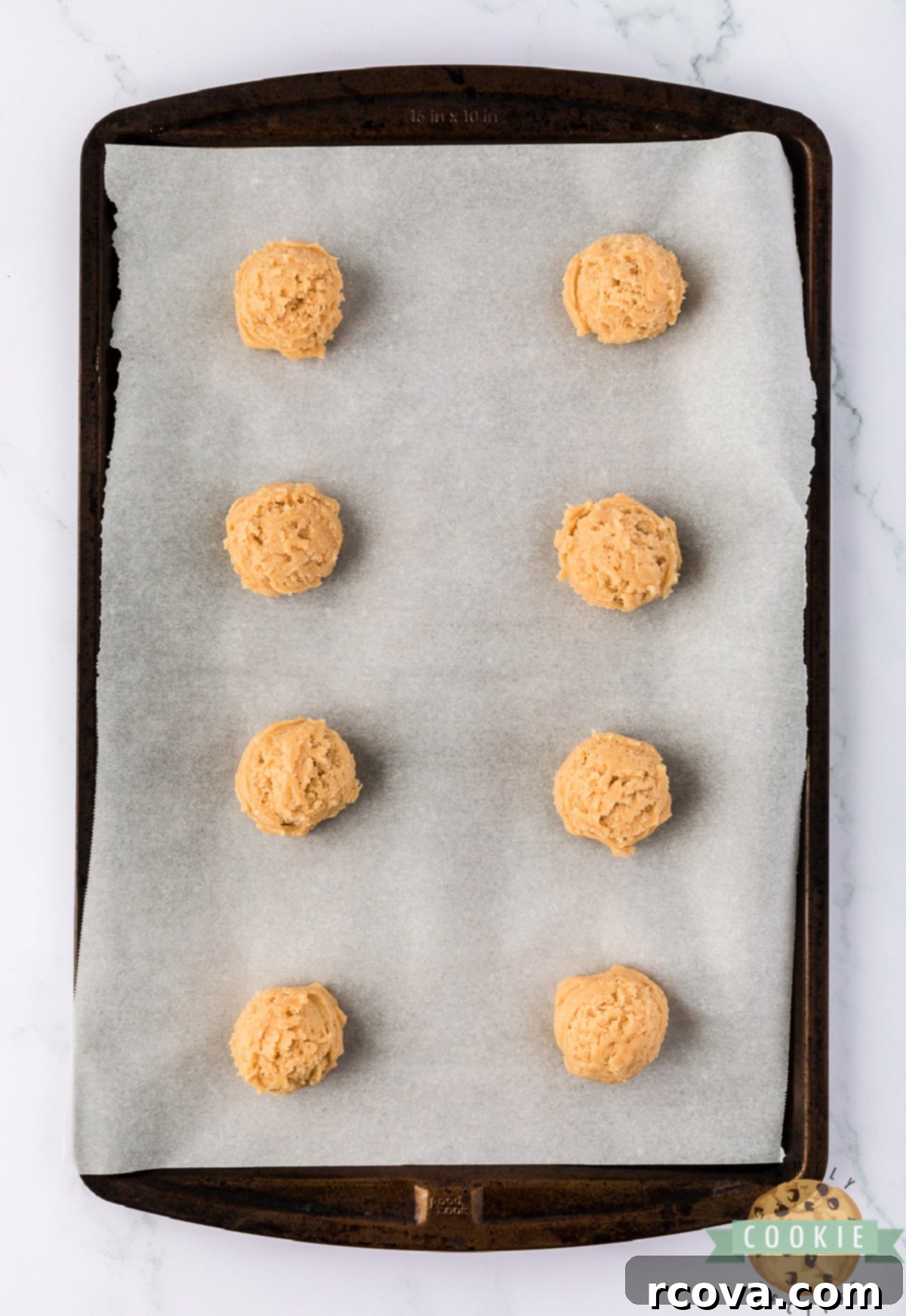 Sweet & Savory Maple Bacon Cookies 7 Cookie dough balls, perfectly scooped and spaced, arranged on a parchment-lined baking sheet, ready for the oven.