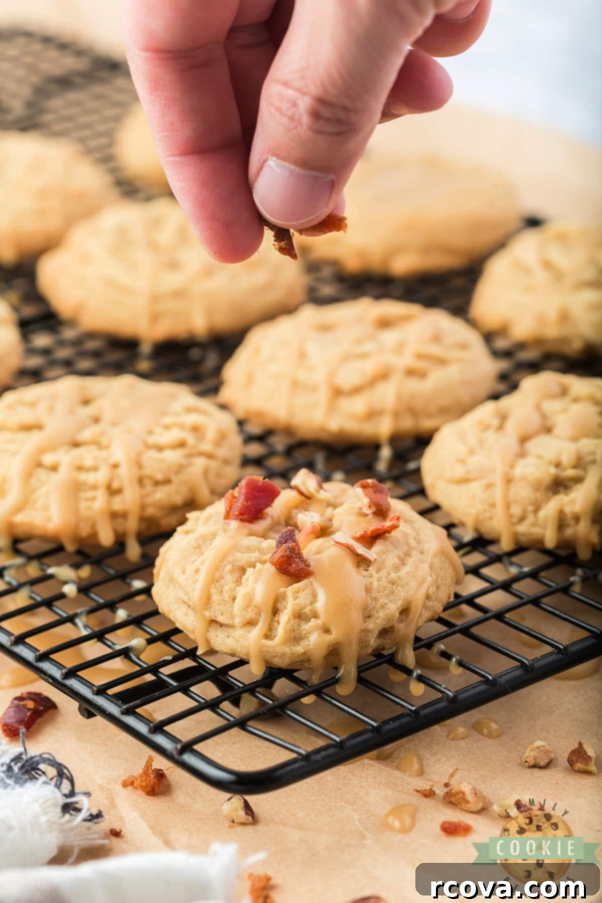 Sweet & Savory Maple Bacon Cookies 10 Maple Bacon Cookies beautifully adorned with maple icing, crispy crumbled bacon, and chopped nuts, ready to be enjoyed.