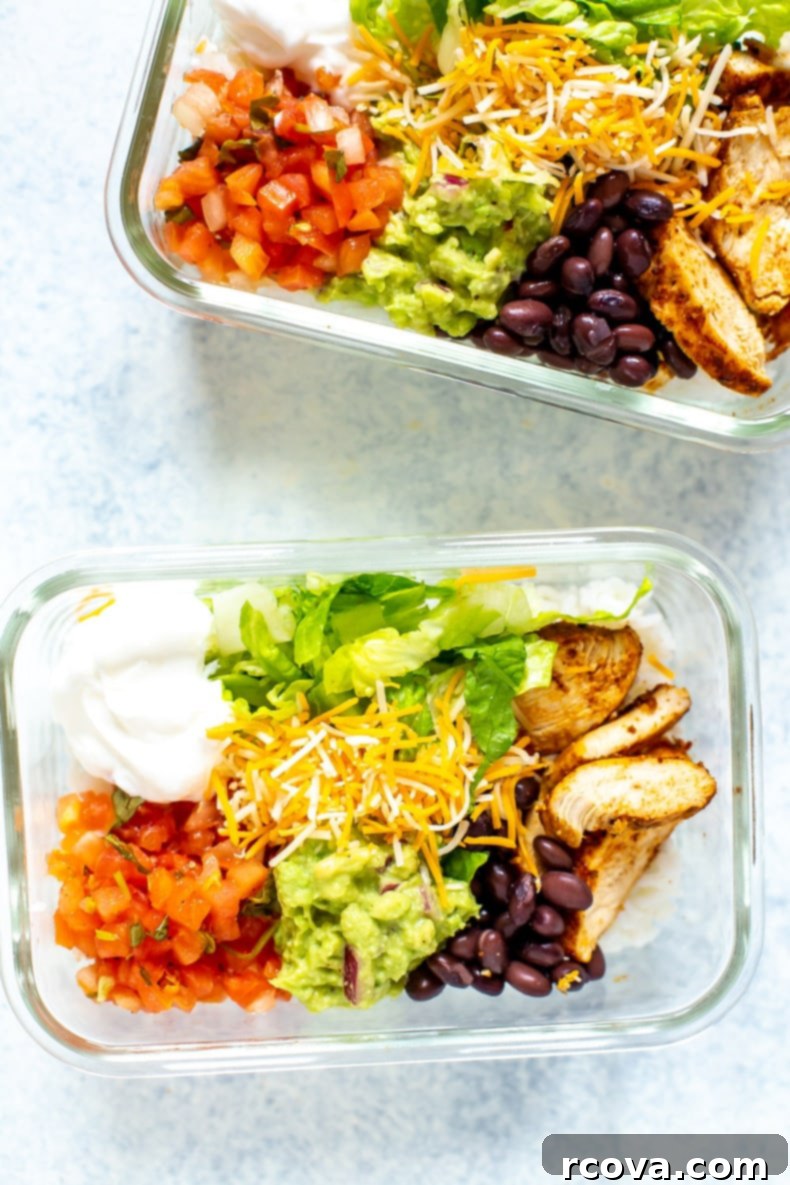 Homemade Taco Bell Power Bowl Recipe 8 A freshly assembled Taco Bell Power Bowl, showcasing layers of seasoned chicken, rice, black beans, guacamole, and colorful fresh toppings, ready to eat.