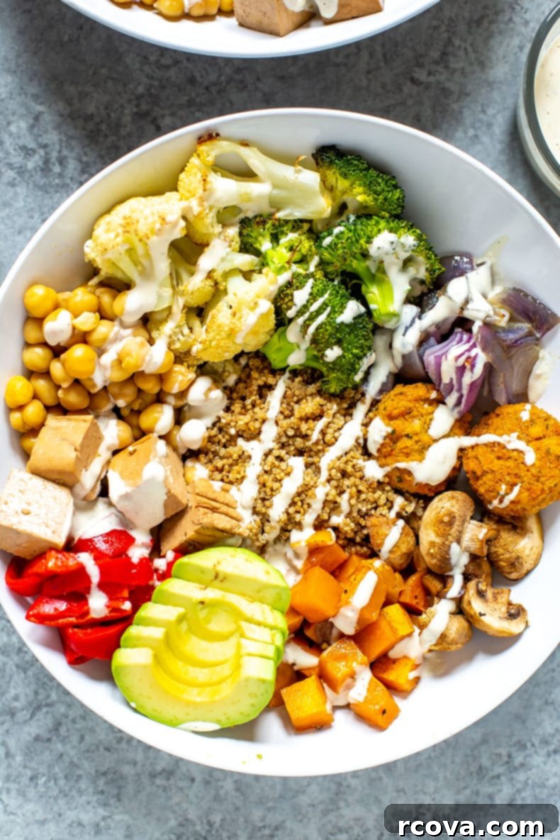 Create Your Perfect Buddha Bowl 6 Close-up of a Buddha Bowl with various roasted vegetables, grains, and protein, highlighting its colorful and balanced nature.