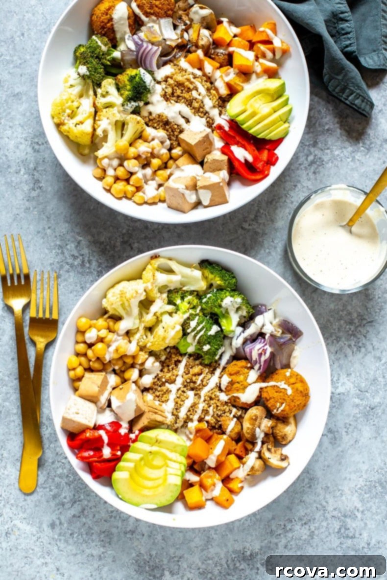 Create Your Perfect Buddha Bowl 8 An aerial view of a vibrant Buddha Bowl, showcasing a mix of colorful vegetables, grains, and protein, topped with a creamy dressing.