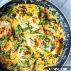 Effortless Creamy Basil Chicken Skillet 10 Creamy Basil Chicken Skillet, garnished with fresh basil leaves.