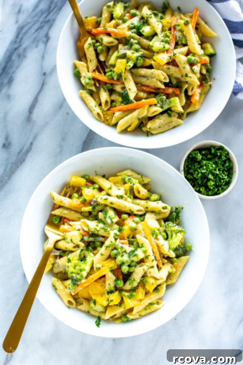 Effortless One-Pot Spring Pasta 8 Close-up of One Pot Pasta Primavera in a serving bowl, garnished with fresh parsley