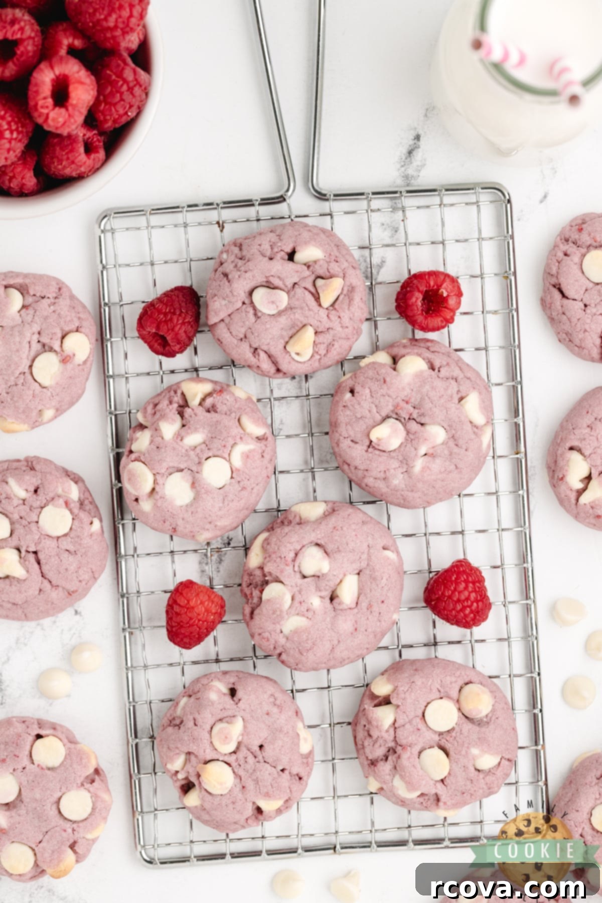 Ruby Red Raspberry Bites 5 Freshly baked Raspberry White Chocolate Chip Cookies cooling on a wire rack.