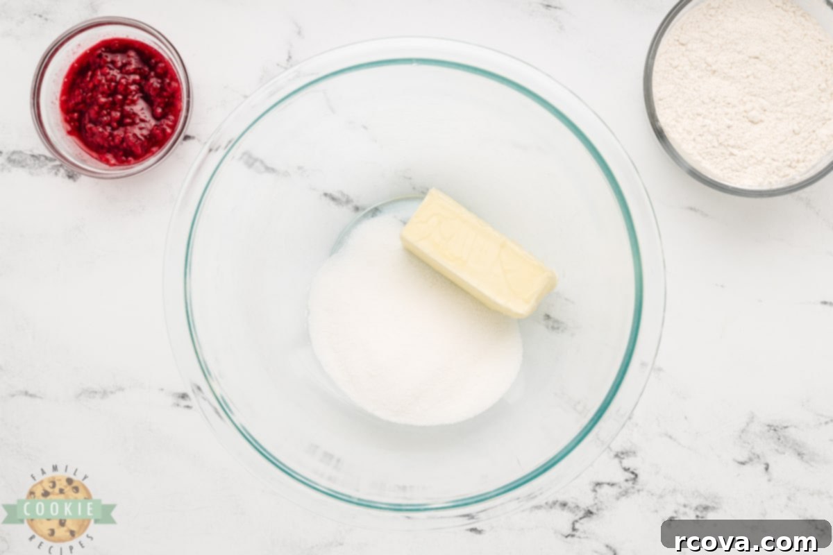 Ruby Red Raspberry Bites 6 Creaming softened butter and granulated sugar together in a mixing bowl.