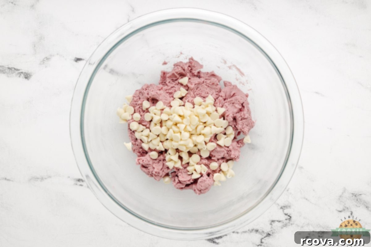 Ruby Red Raspberry Bites 9 Gently folding white chocolate chips into the pink raspberry cookie dough.