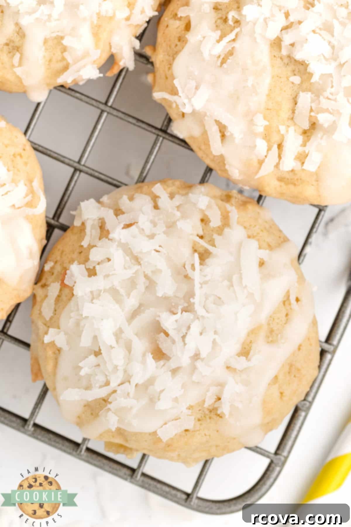 Piña Colada Paradise Bites 3 Cookie topped with pineapple glaze and shredded coconut.
