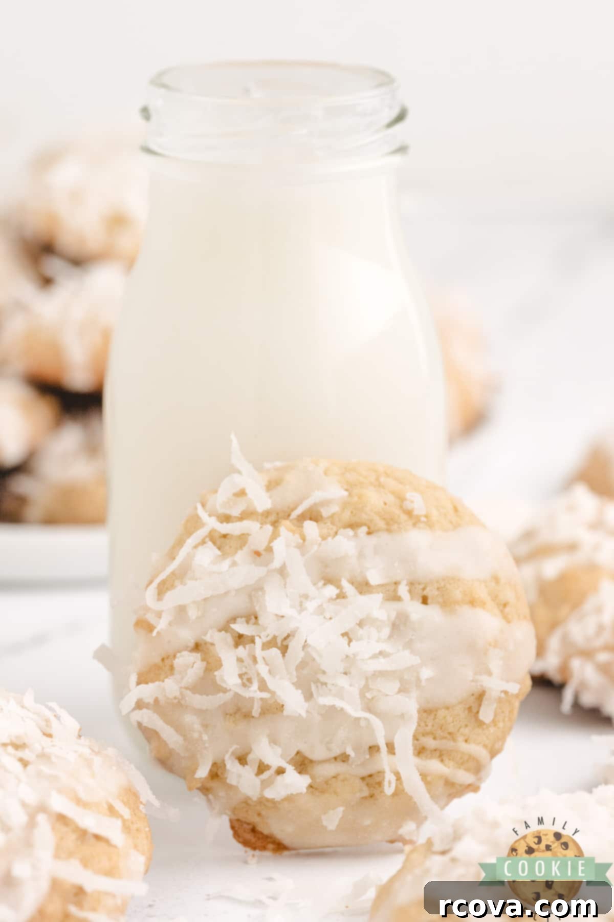 Piña Colada Paradise Bites 7 Pineapple coconut cookie with glaze and shredded coconut on top.