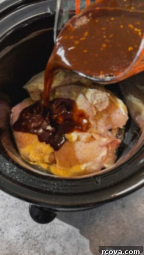Simply Wholesome Slow Cooker Sesame Chicken 3 Pouring homemade sesame sauce over seasoned chicken in a slow cooker