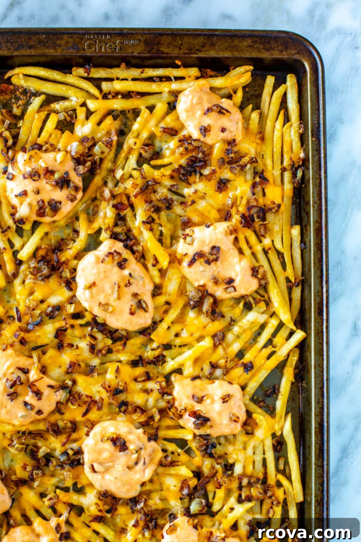 Make Your Own In-N-Out Animal Style Fries 7 A sheet pan with animal style fries.
