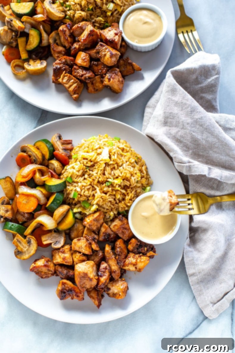 Ultimate Hibachi Chicken 2 Homemade Hibachi Chicken served with fried rice and vegetables