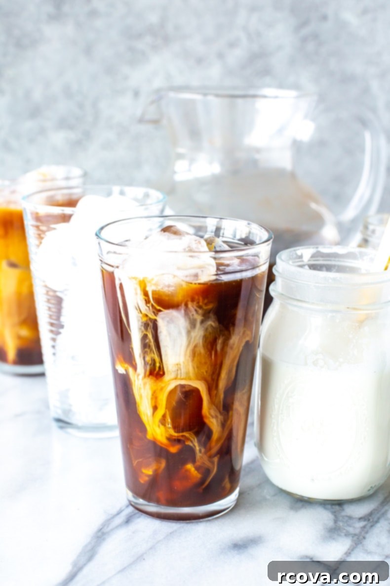Starbucks Copycat Vanilla Sweet Cream Cold Brew 9 Vanilla Sweet Cream Cold Brew in a cup on a wooden surface