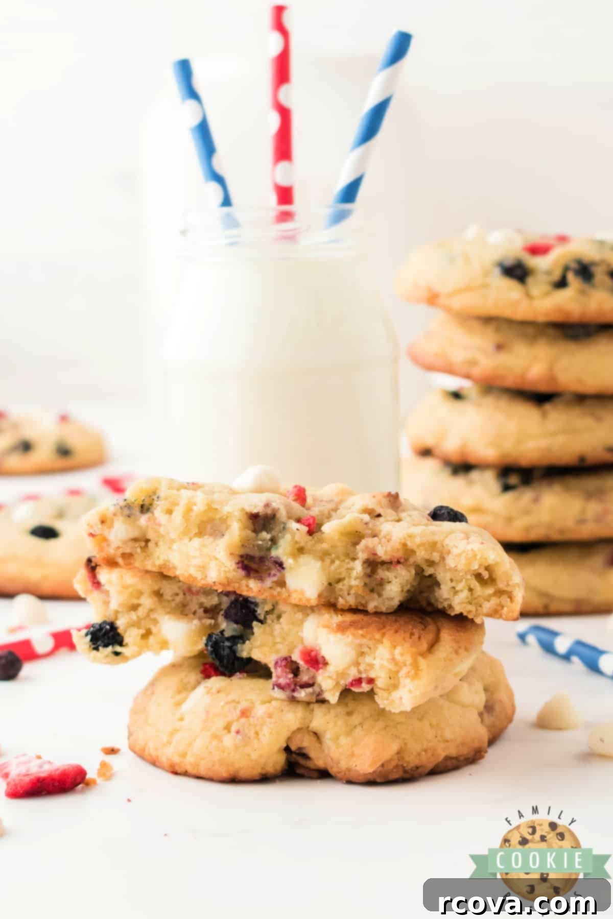 Stars and Stripes Cream Cheese Cookies 3 Close-up of freshly baked Red, White & Blue Cream Cheese Cookies on a baking sheet, showing the freeze-dried blueberries and strawberries.