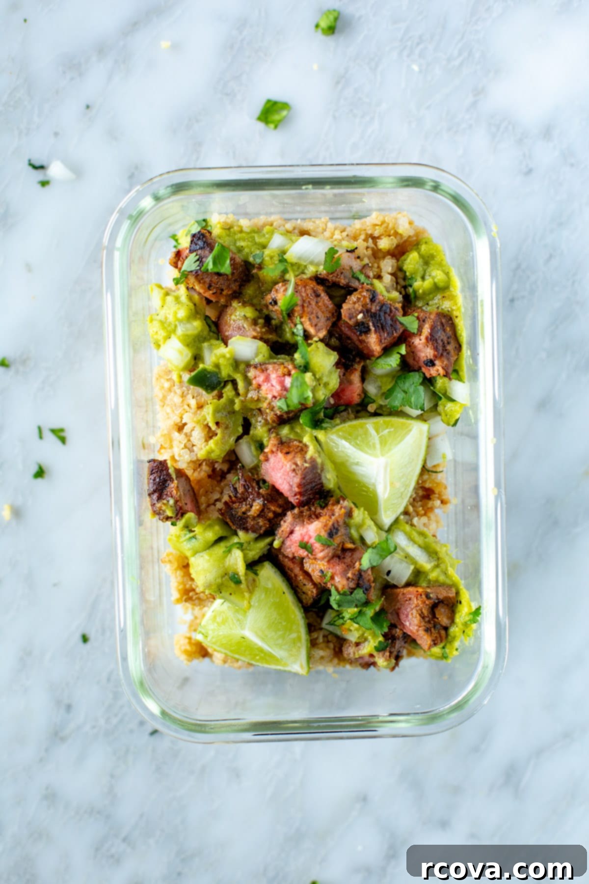 Sizzling Carne Asada Tacos 10 Carne asada steak and various toppings neatly arranged in a glass meal prep bowl, ready for storage.