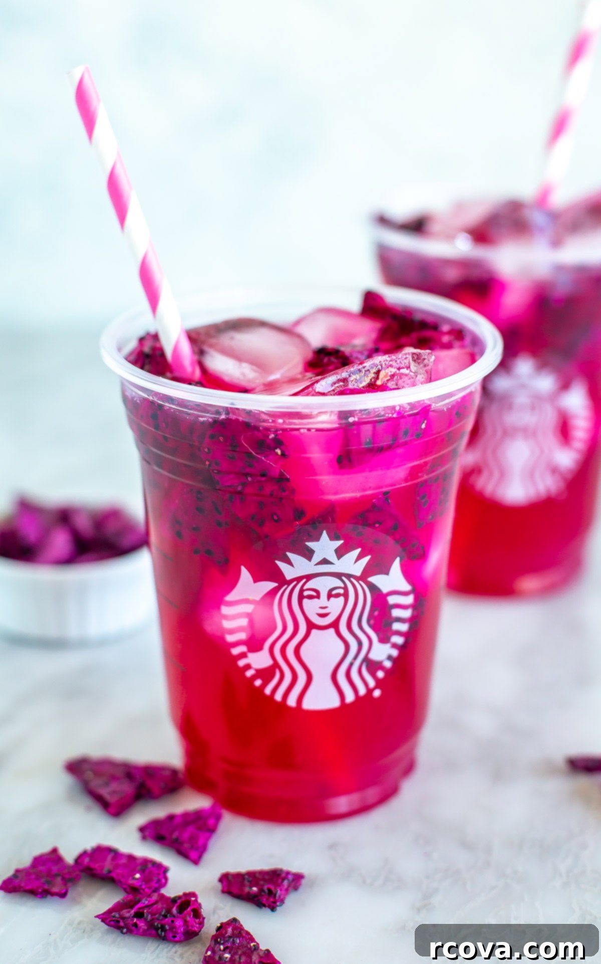 Vibrant Mango Dragonfruit Refresher 9 A close-up of a Starbucks mango dragonfruit refresher showing the vibrant color and dragonfruit pieces.