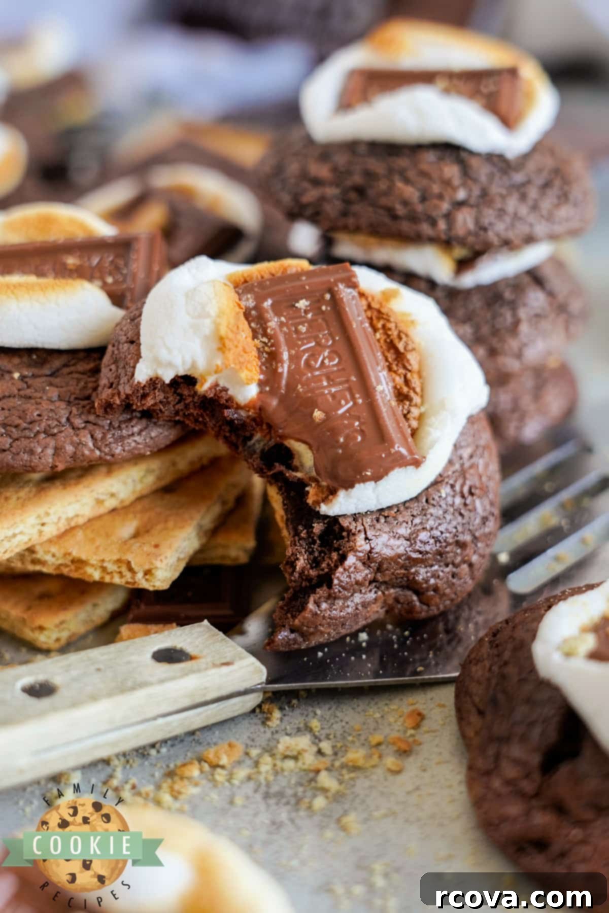S'mores Brownie Cookies 3 Brownie cookie with marshmallows, graham crackers, and chocolate bar.