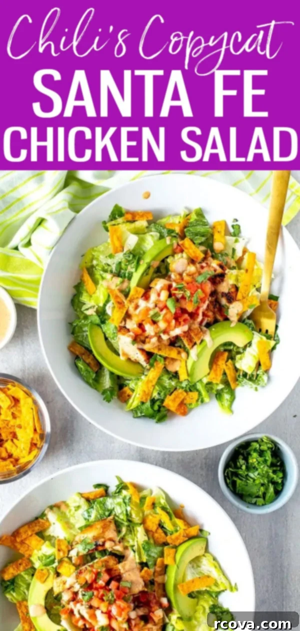 Fiery Mesa Chicken Salad 13 This Santa Fe Chicken Salad is a perfect Chili's copycat recipe loaded with spicy chicken, yummy veggies, tortilla strips and Santa Fe sauce. #chilis #santafesalad