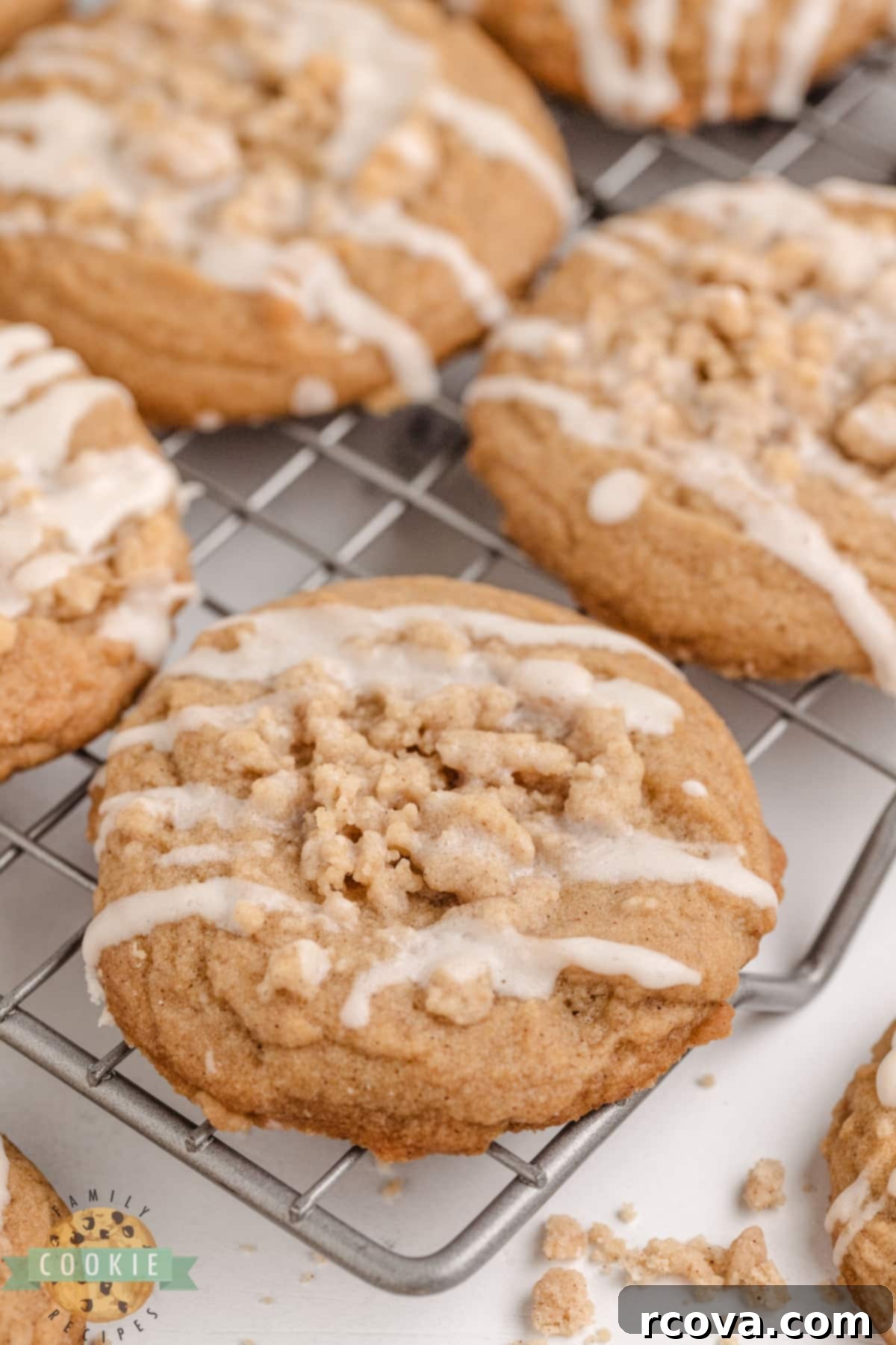 Cinnamon Streusel Cookies 3 Close-up of a cinnamon cookie topped with a golden streusel crumb and delicate vanilla glaze.