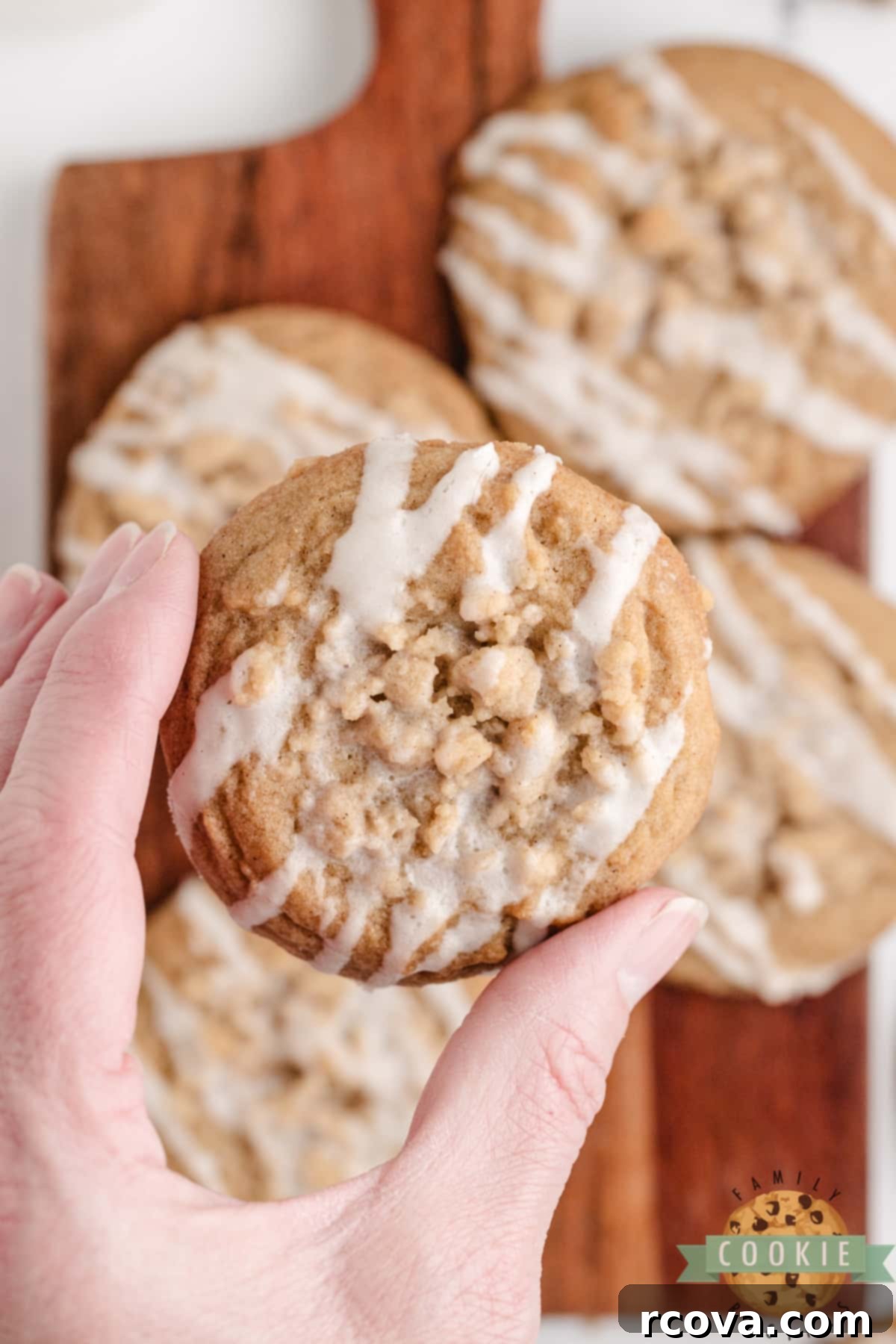 Cinnamon Streusel Cookies 5 Delicious cinnamon cookie adorned with streusel crumb and delicate vanilla icing, ready to be enjoyed.