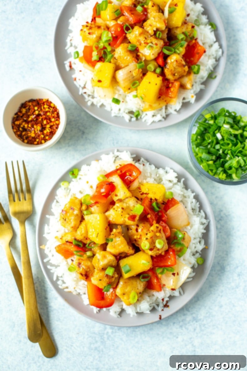 Copycat Panda Express Sweet Fire Chicken 2 Panda Express Sweetfire Chicken, featuring crispy chicken, red peppers, onions, and pineapple in a glossy, sweet and spicy sauce.
