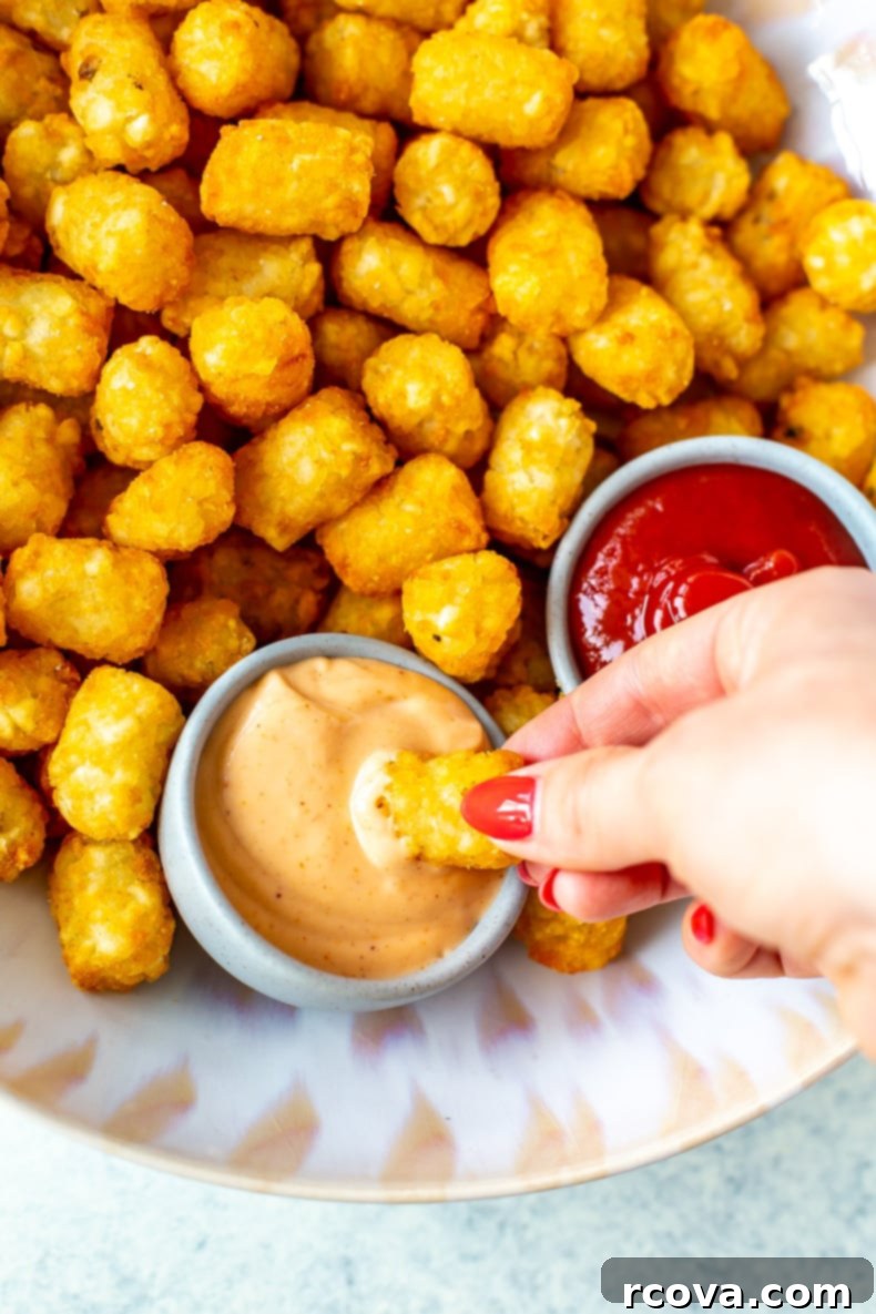 Ultimate Crispy Air Fryer Tater Tots 9 Air Fryer Tater Tots on a platter