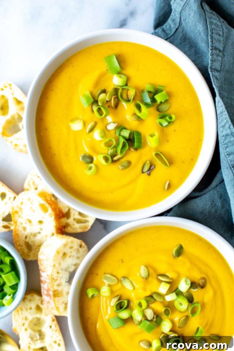 Simply Irresistible Kabocha Squash Soup 7 Close-up of a rustic bowl of Kabocha Squash Soup, garnished with roasted pumpkin seeds and fresh sage leaves.
