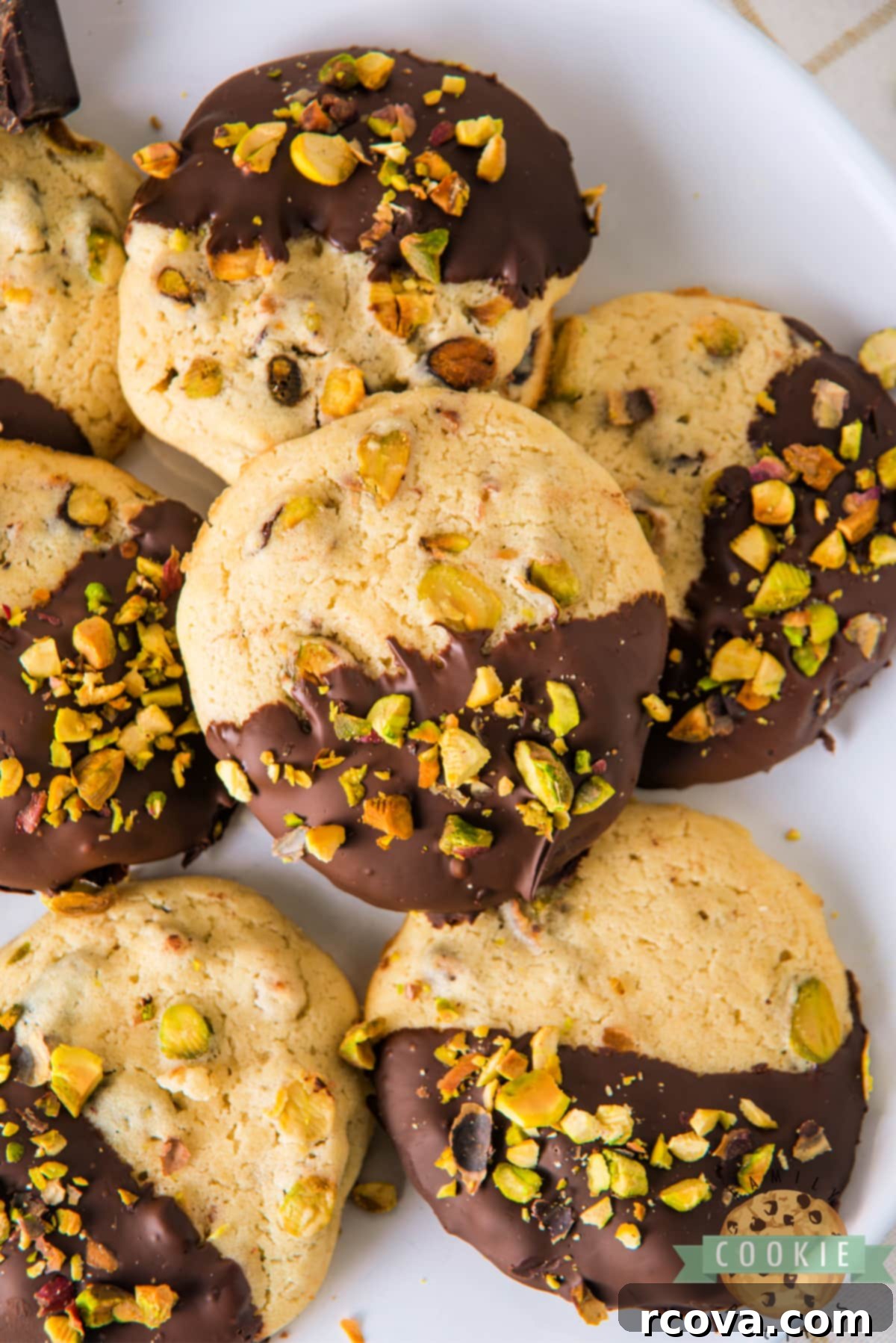 Chocolate Kissed Pistachio Delights 12 Chocolate Dipped Pistachio Cookies are soft and chewy pistachio cookies coated with dark chocolate. Freeze the dough and then slice and bake when ready to eat!
