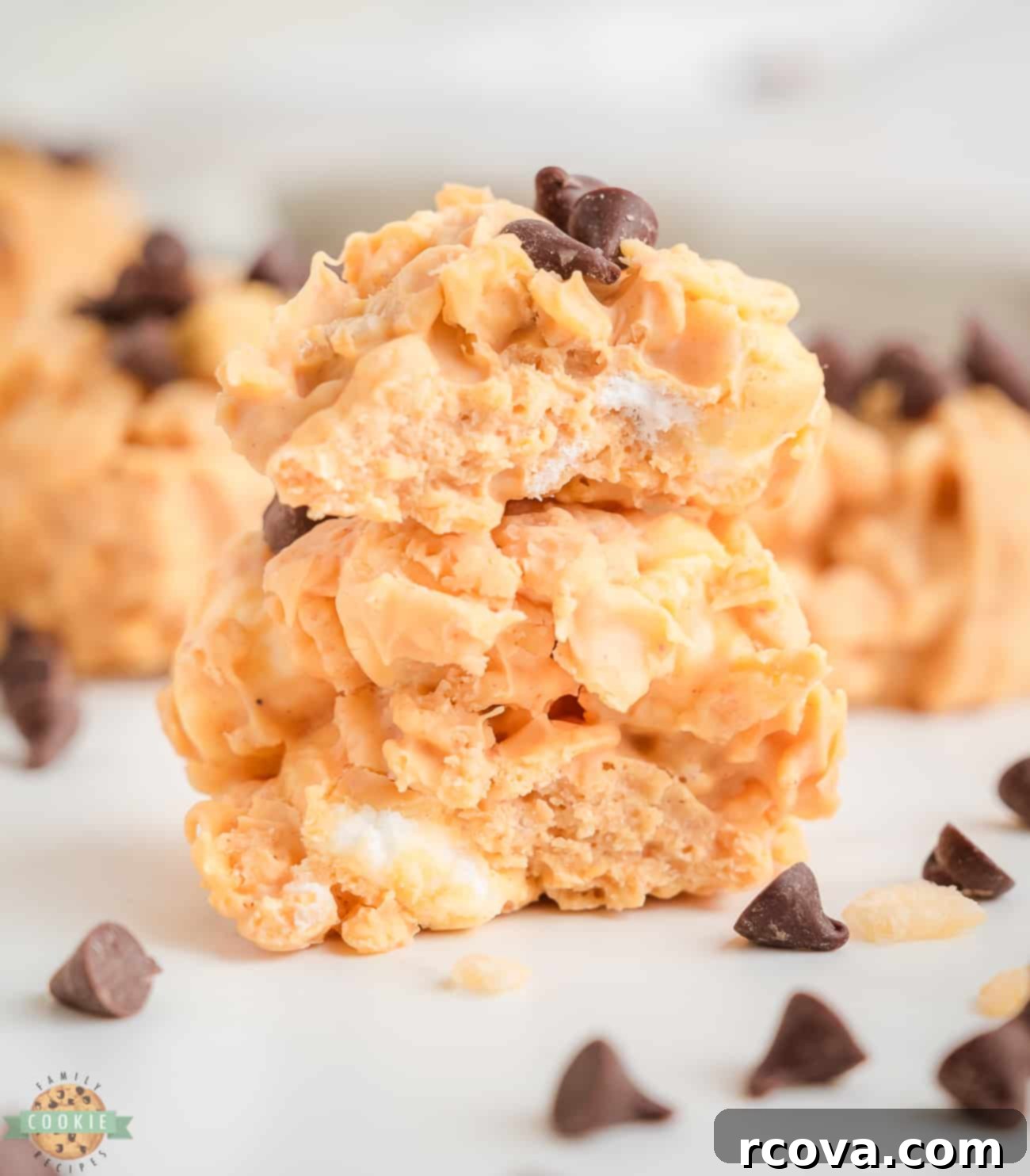 Easy Avalanche Bites 3 A delicious peanut butter marshmallow avalanche cookie broken in half, revealing its gooey texture and crispy cereal.
