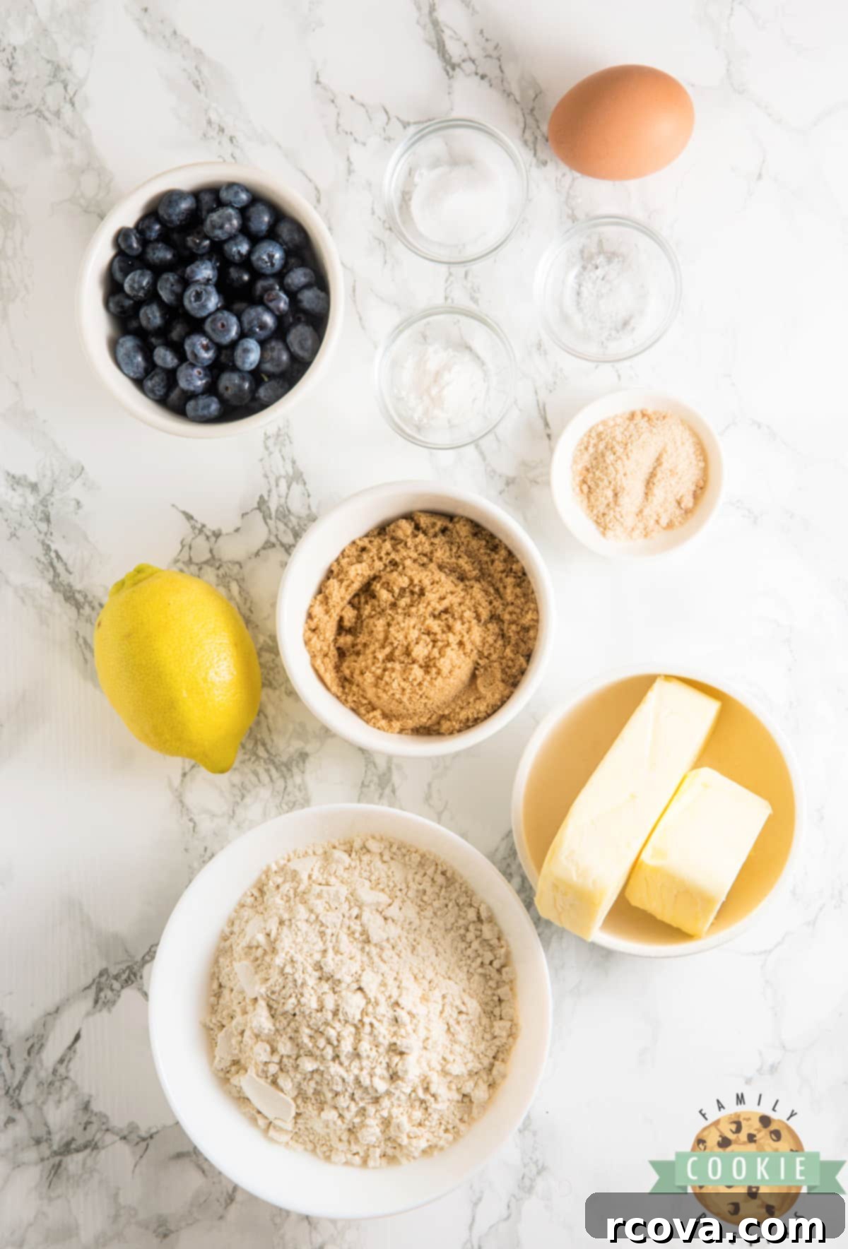 Sunshine Berry Muffin Cookies 4 All the fresh ingredients laid out for making Lemon Blueberry Muffin Cookies, including butter, sugar, lemons, and blueberries.
