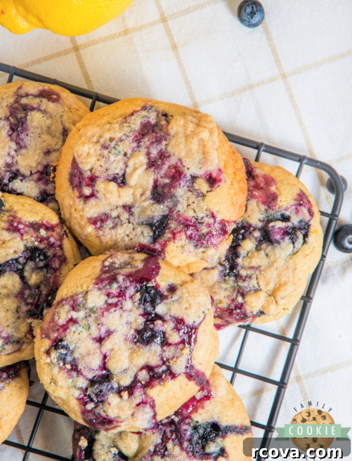 Sunshine Berry Muffin Cookies 5 Freshly baked blueberry muffin cookies with a lemon glaze.