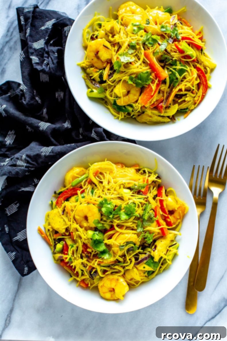 PF Changs Inspired Singapore Street Noodles 2 Singapore Street Noodles — A vibrant dish with chicken, shrimp, and colorful vegetables, glistening with curry sauce.