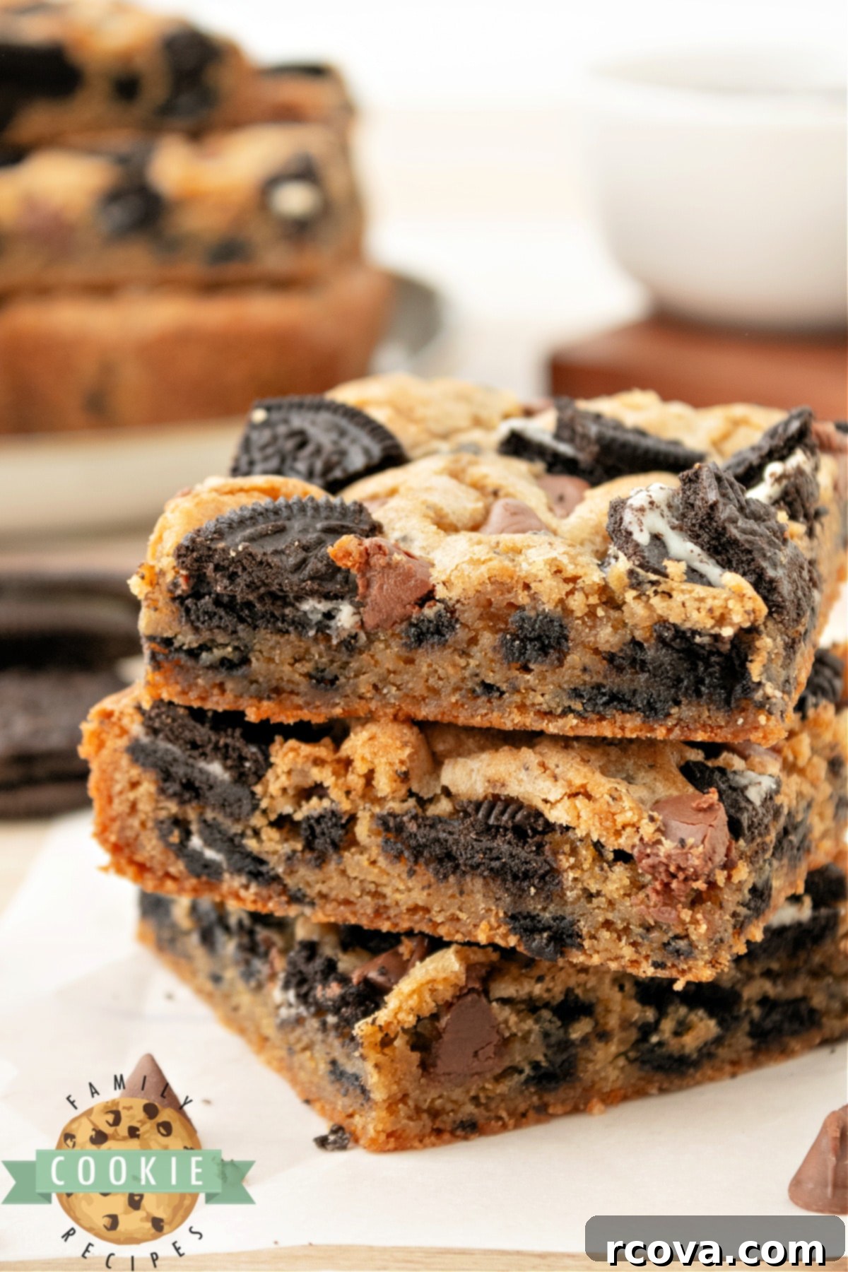 Ultimate Oreo Bars 9 A stack of perfectly cut Oreo Cookie Bars, showcasing their layers of soft cookie and crunchy Oreo pieces, ready to be enjoyed.