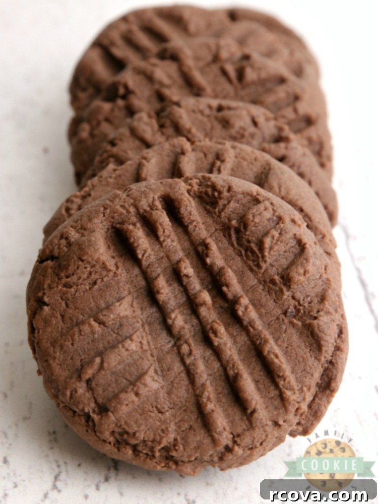 Effortless Chocolate Peanut Butter Cake Mix Cookies 2 Soft and chewy chocolate peanut butter cake mix cookies stacked on a plate