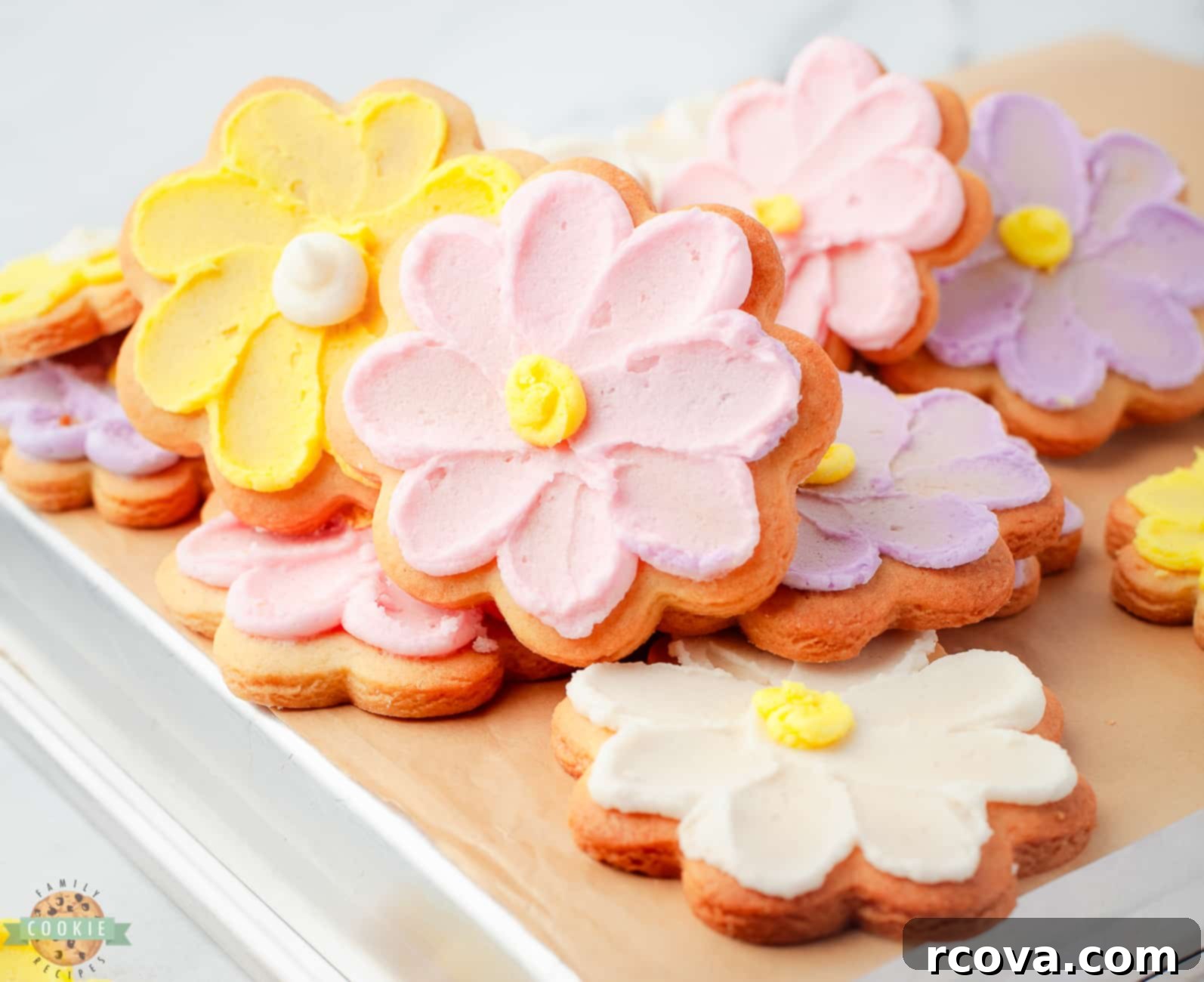 Sweet Buttercream Blooms 3 pile of flower cookies with buttercream daisies on them