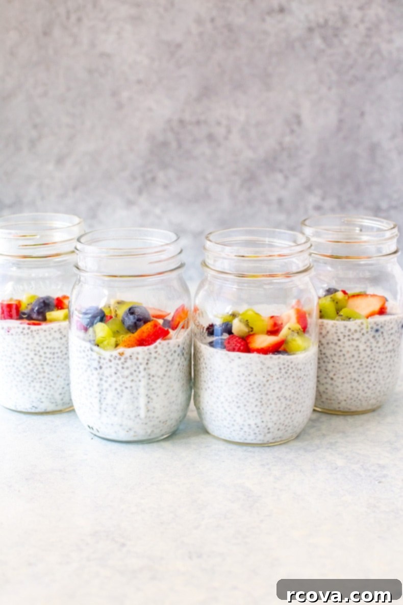 Easy 4-Ingredient Protein Chia Pudding 8 High-Protein Chia Pudding in a clear mason jar with a spoon, showing its creamy texture and fresh berries.