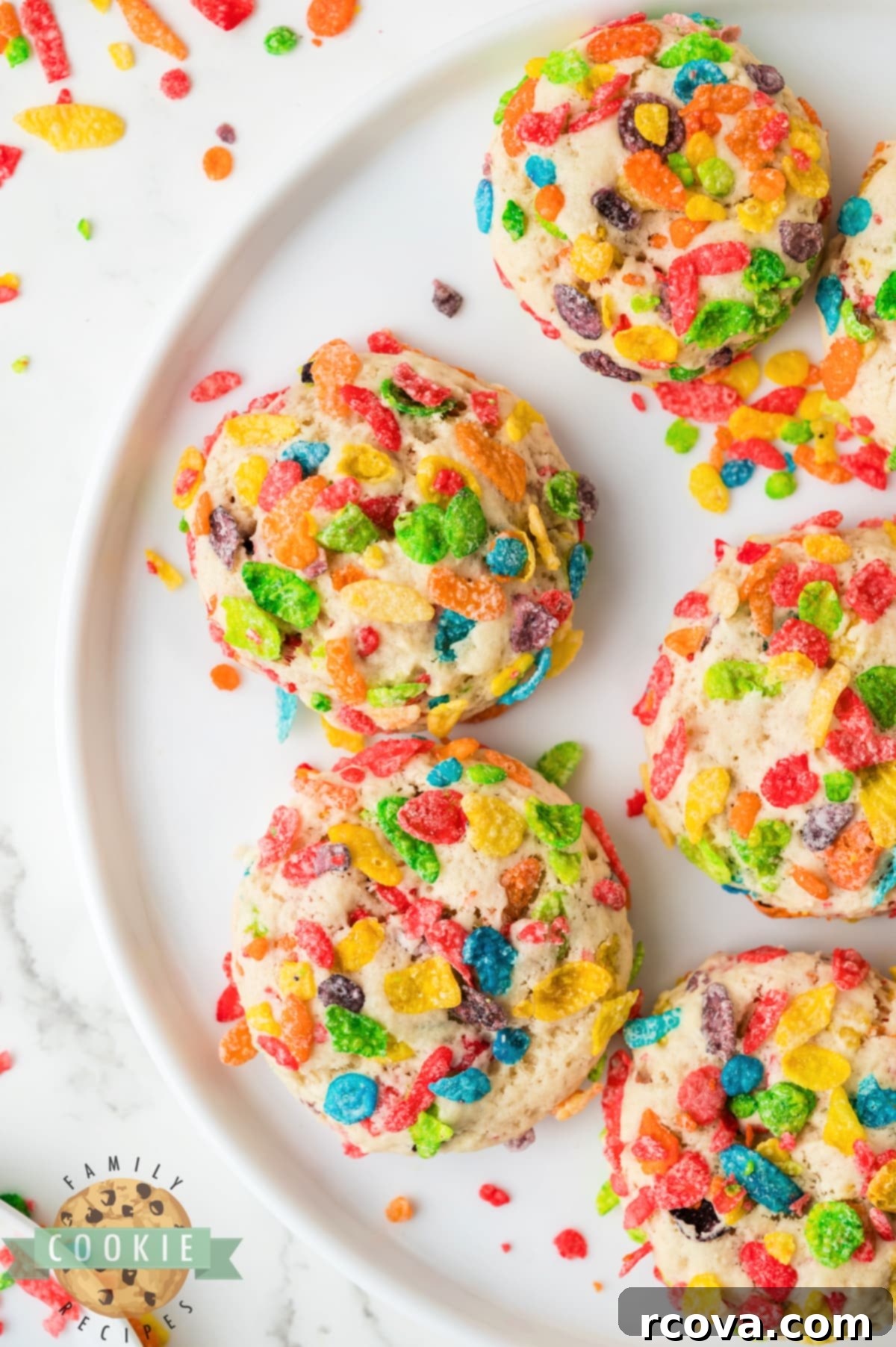 Vibrant Cereal Cookie Delights 14 A plate of freshly baked, colorful Fruity Pebbles sugar cookies.