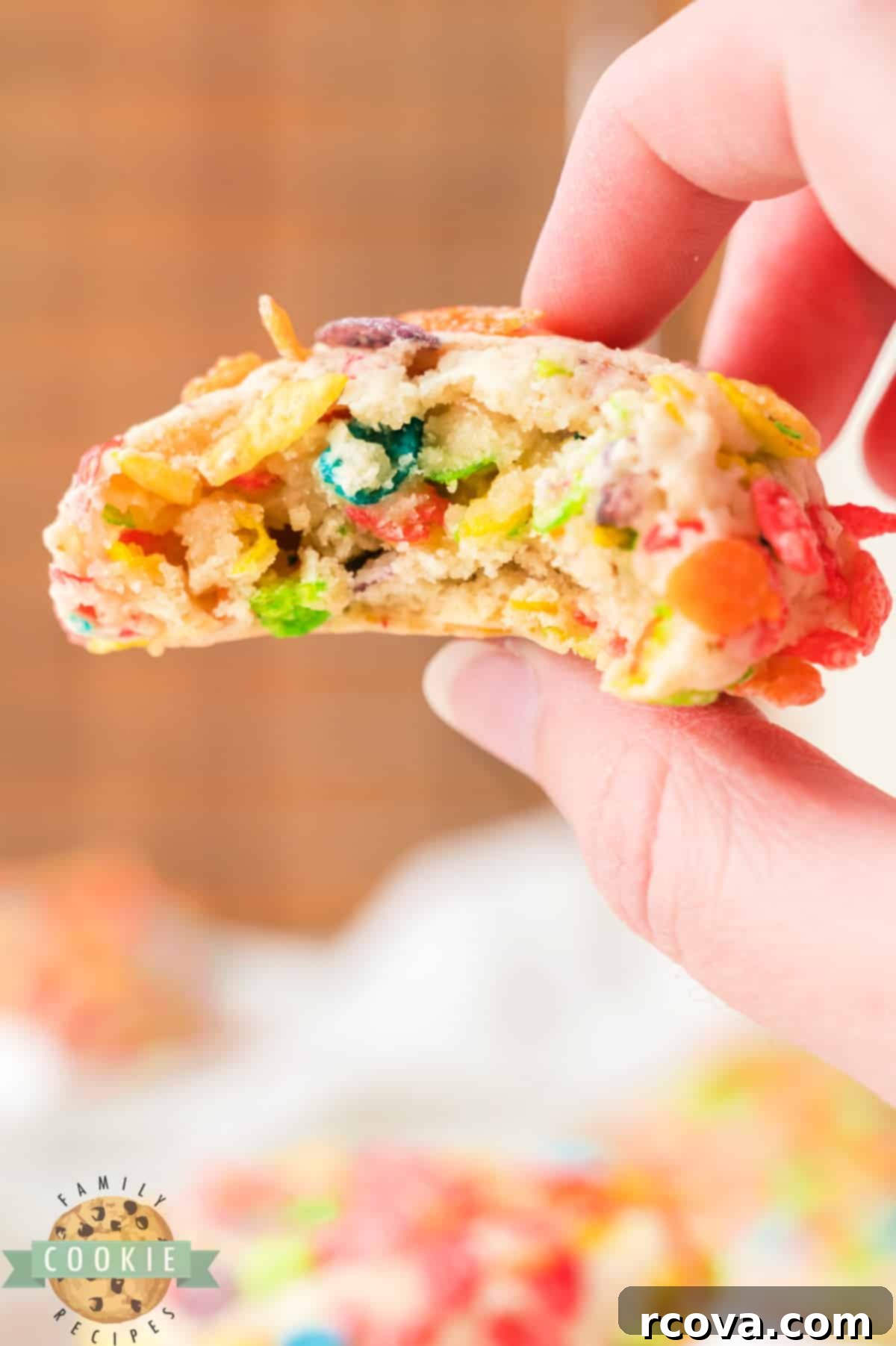 Vibrant Cereal Cookie Delights 16 A delicious Fruity Pebbles cookie with a bite taken out, showing the cereal baked within.