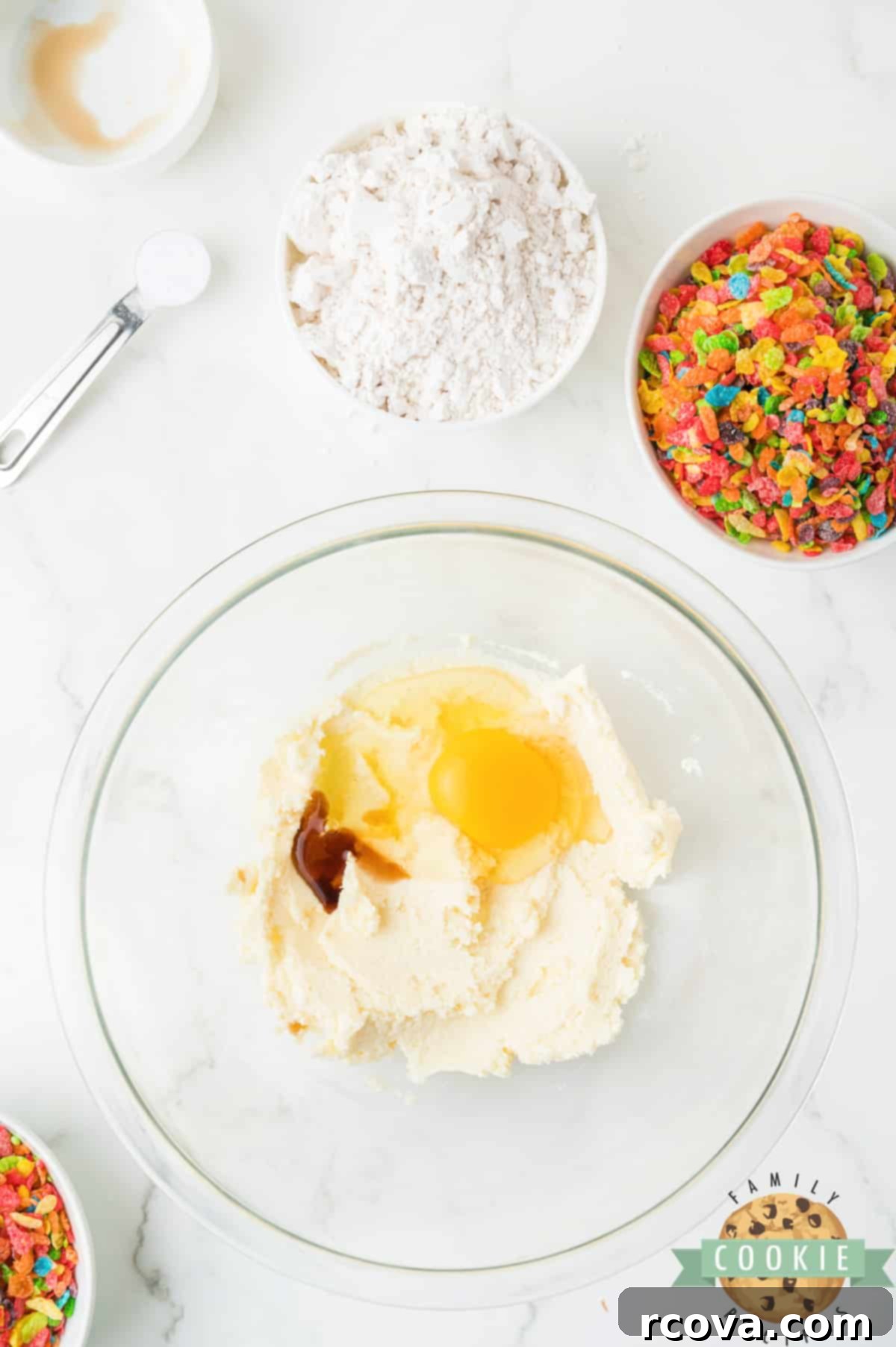 Vibrant Cereal Cookie Delights 6 Adding an egg and vanilla extract to the creamy butter and sugar mixture.
