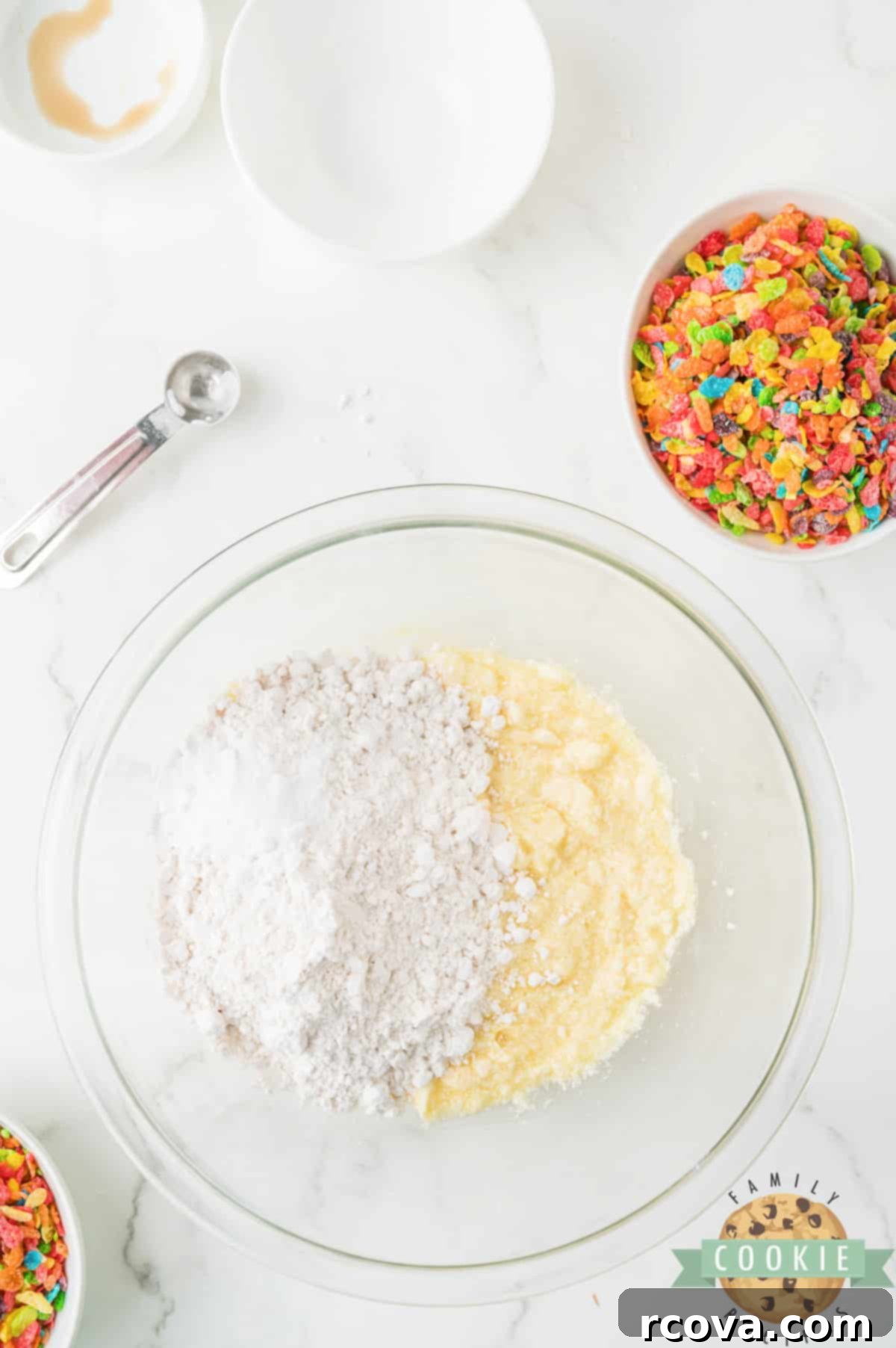 Vibrant Cereal Cookie Delights 7 Mixing flour and baking soda into the wet cookie dough mixture.