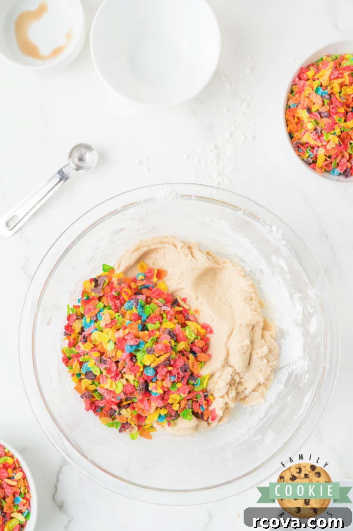 Vibrant Cereal Cookie Delights 8 Gently folding colorful Fruity Pebbles cereal into the cookie dough.