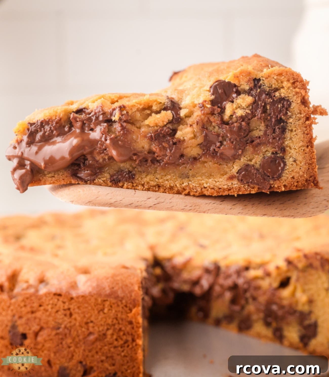 Heavenly Nutella Cookie Cake 4 serving up a slice of stuffed cookie pie