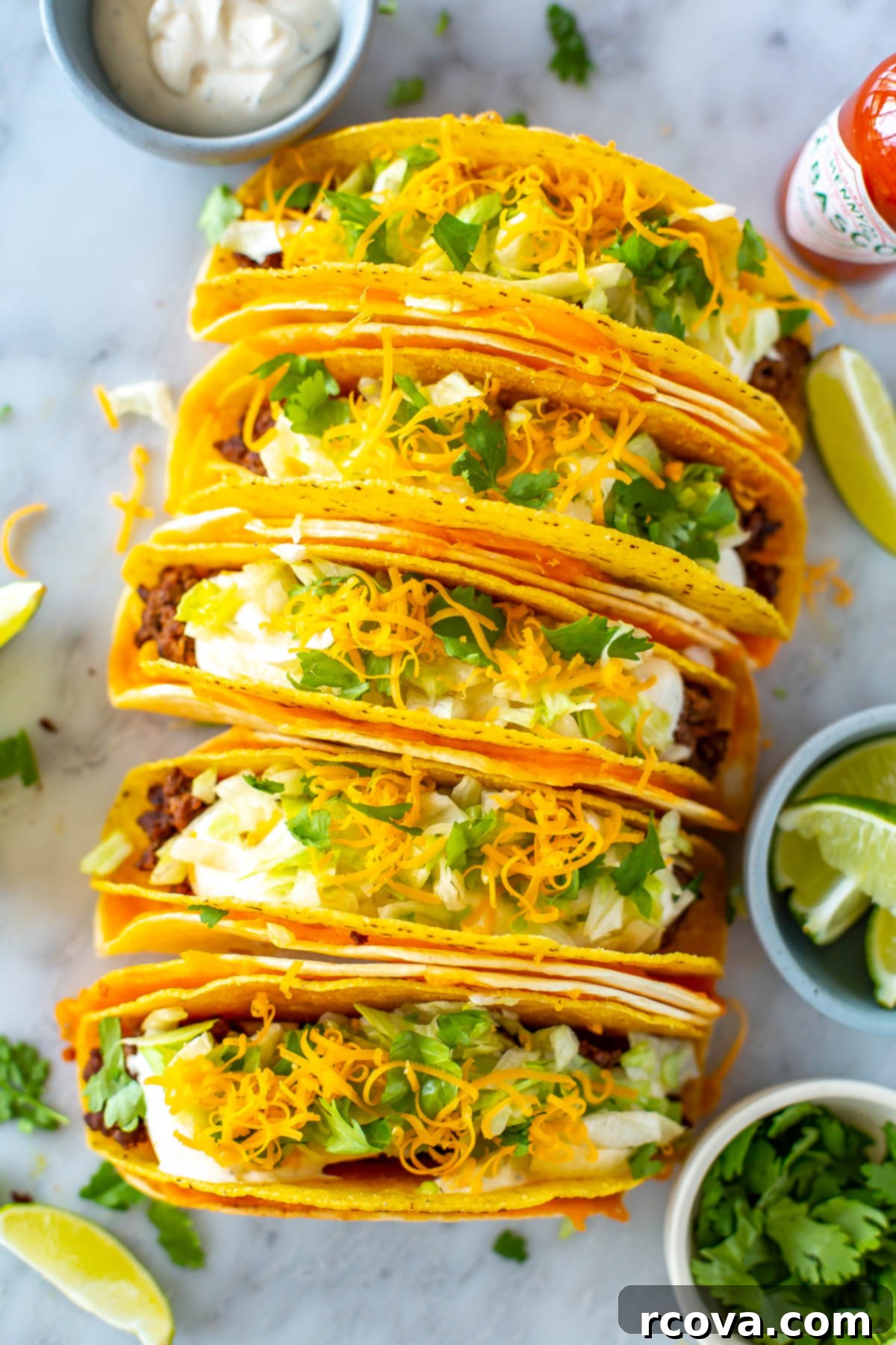 Copycat Cheesy Gordita Crunch Perfection 2 An overhead shot of five cheesy gordita crunch tacos, perfectly assembled and ready to be enjoyed.