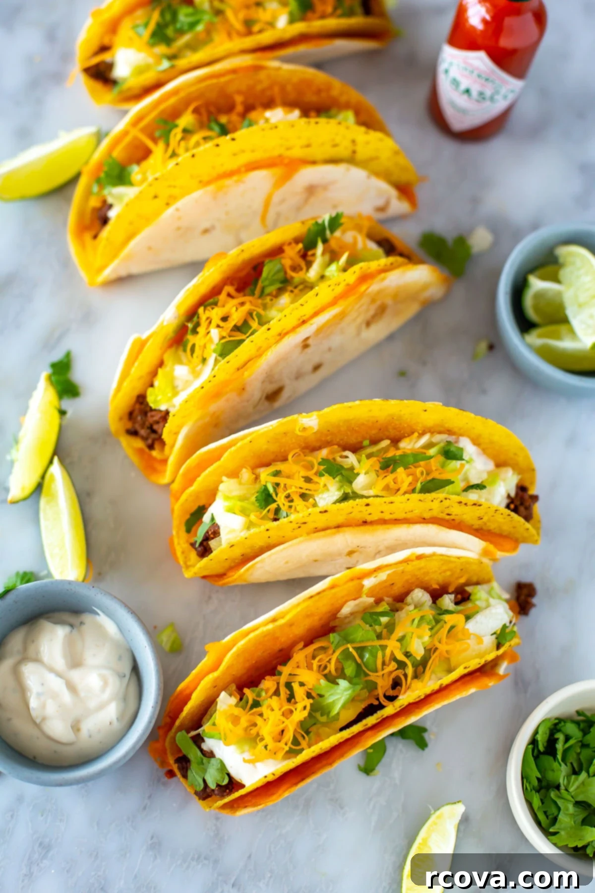 Copycat Cheesy Gordita Crunch Perfection 9 An inviting overhead shot of several cheesy gordita crunch tacos, beautifully garnished with all their fresh, colorful toppings, showcasing their delicious appeal.