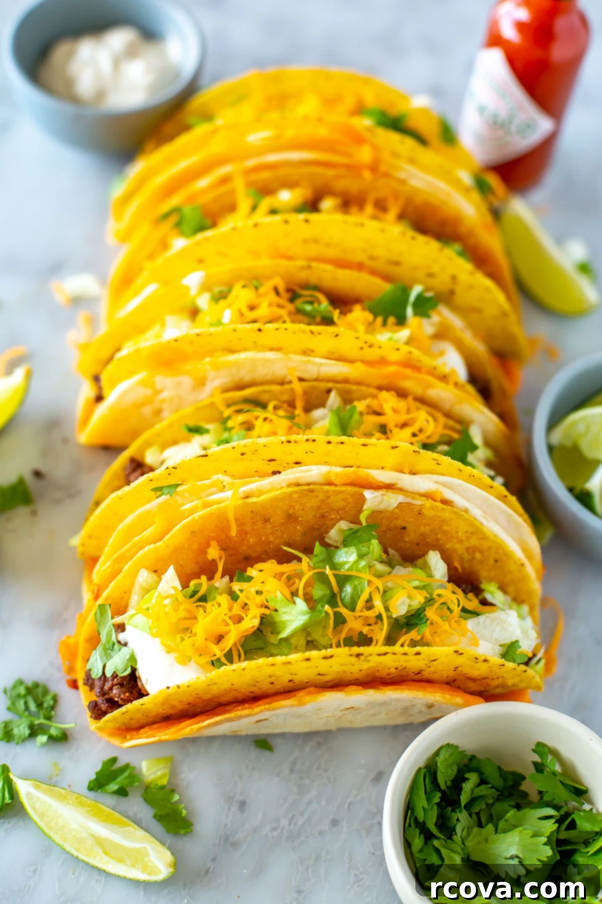 Copycat Cheesy Gordita Crunch Perfection 10 Several perfectly lined up cheesy gordita crunch tacos, showcasing their consistent and appealing presentation.