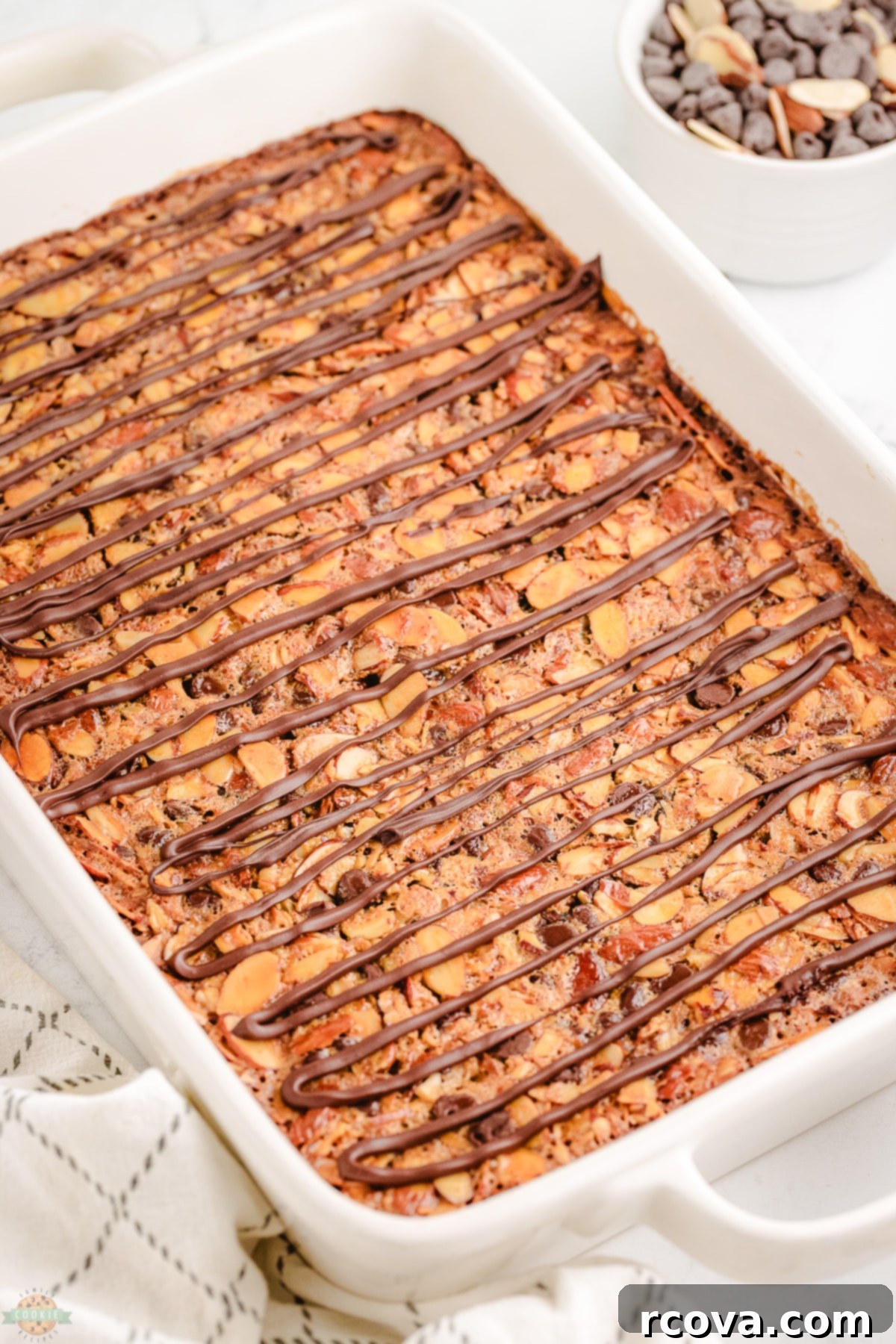 Decadent Chocolate Almond Bars 6 A pan of perfectly baked and drizzled chocolate almond bars before cutting