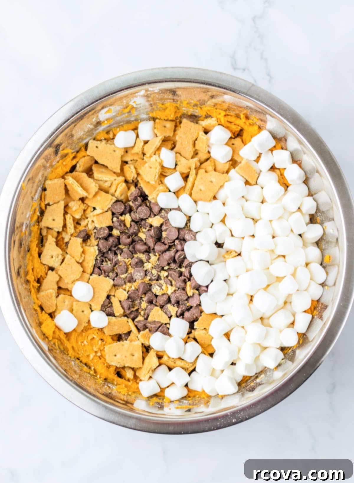 Spiced Pumpkin Smores Cookie Cake 10 Add graham crackers, chocolate chips, and marshmallows to dough.