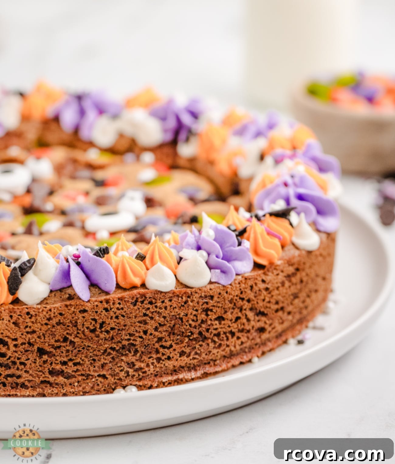 Spooky Cookie Cake 2 Halloween cookie cake with purple and orange rosette frosting and sprinkles