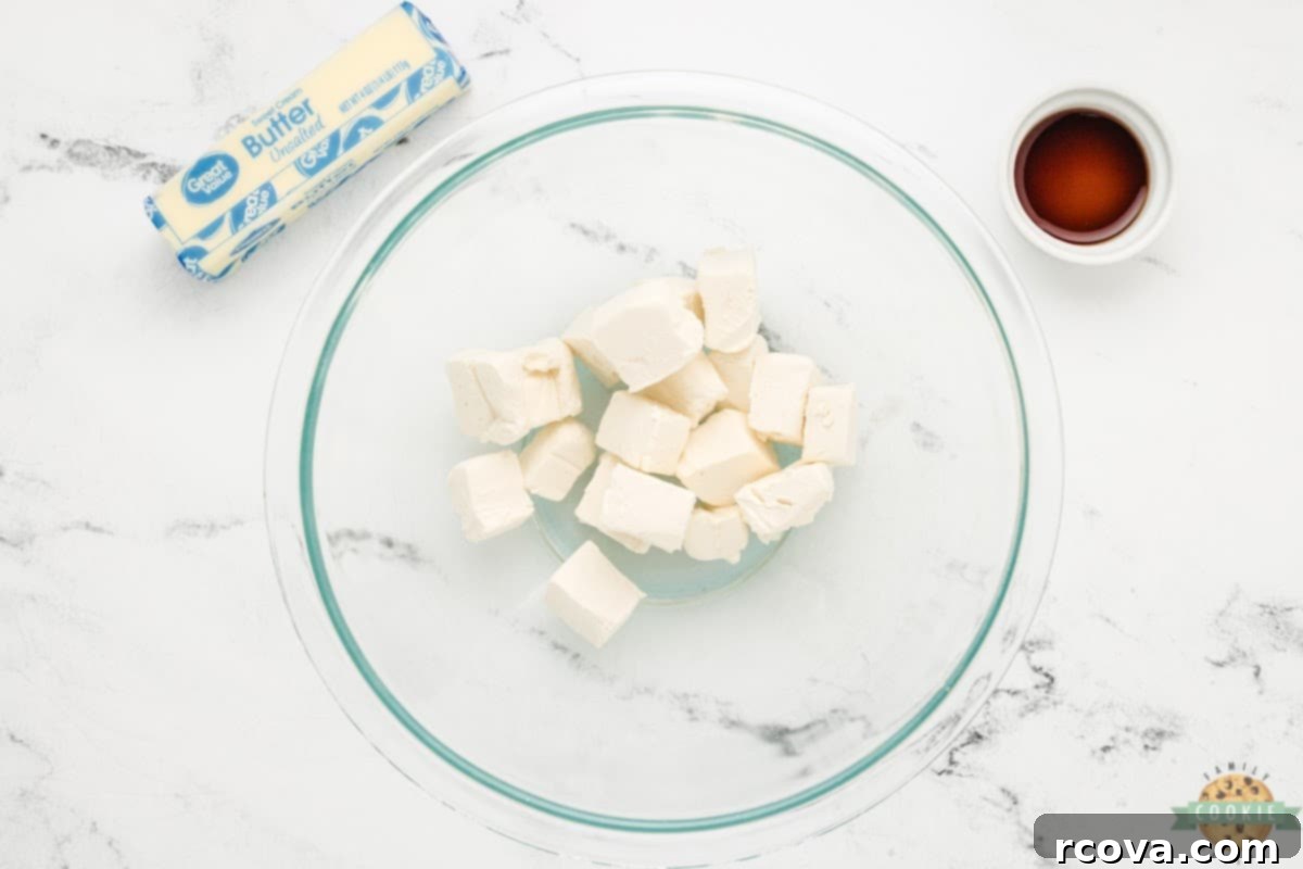 Irresistible White Chocolate Cranberry Cookie Bars 10 Softened cream cheese in a bowl, ready to be beaten for a smooth and creamy frosting.