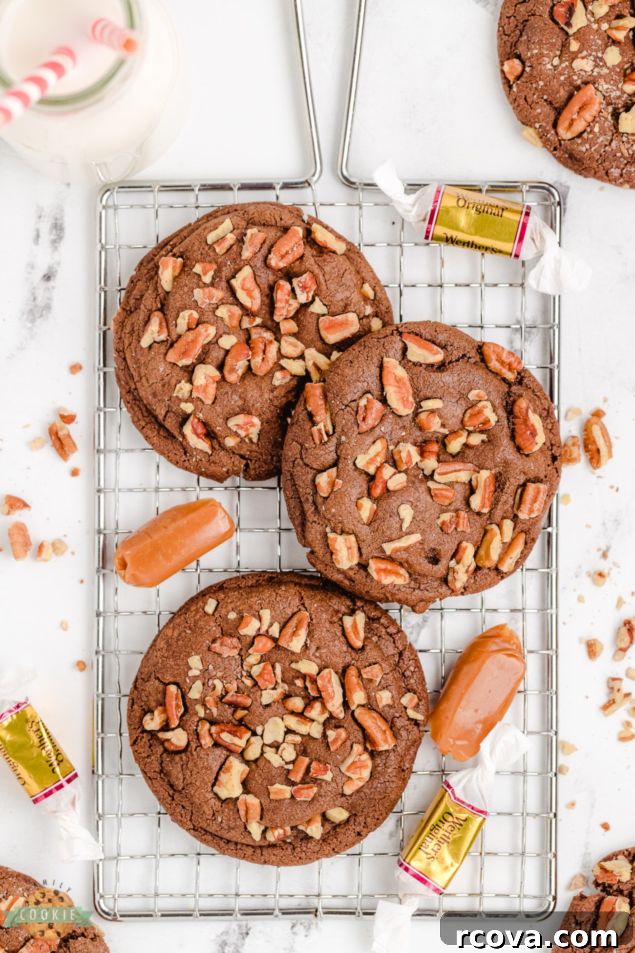 Gooey Caramel Pecan Chocolate Cookies 5 jumbo turtle cookies on a cooling rack